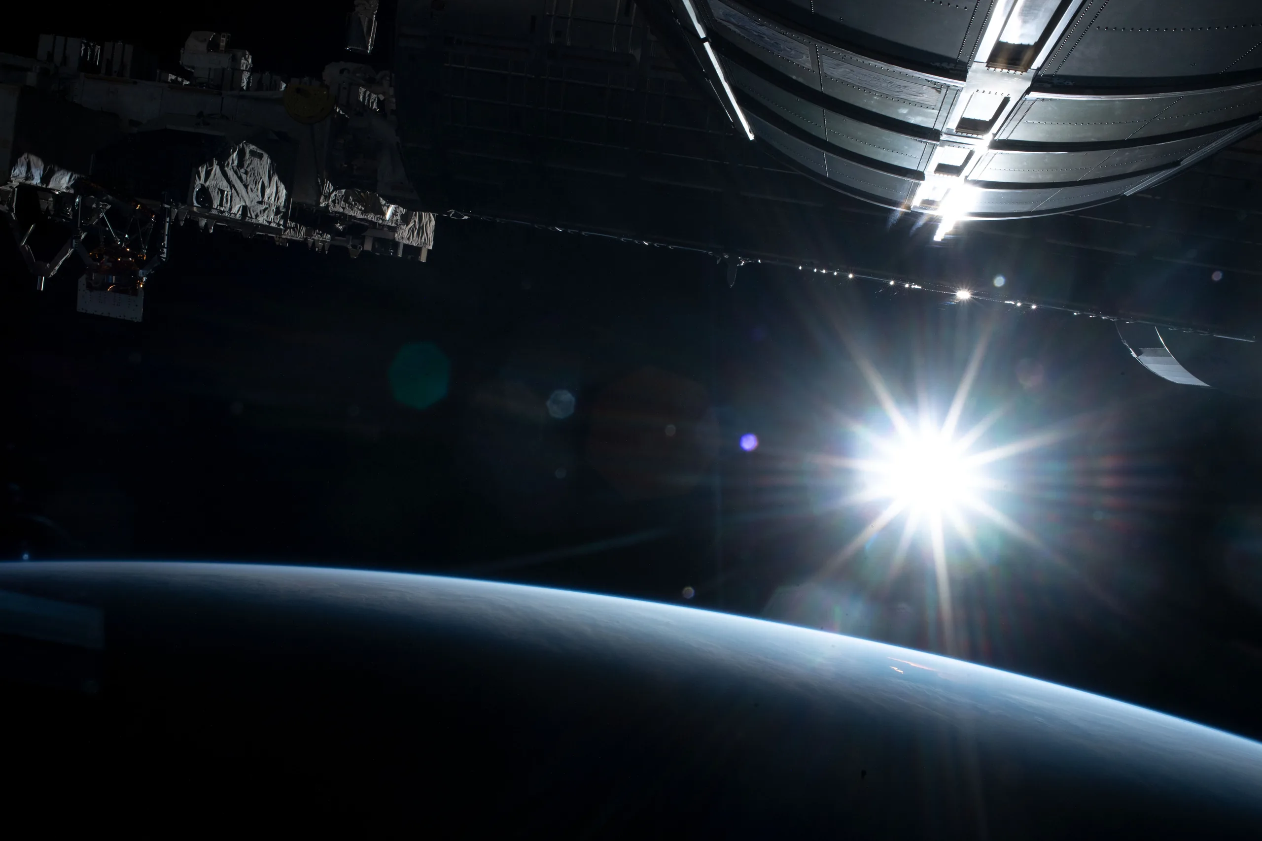 The sun illuminating Earth's limb above the Pacific Ocean, seen from the International Space Station (NASA)